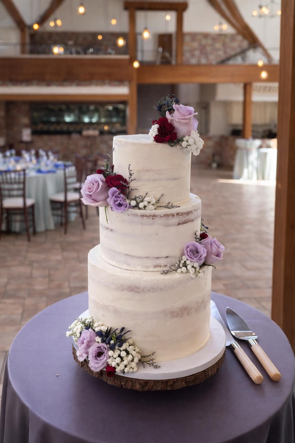 Three-tiered semi-naked cake with lavender roses