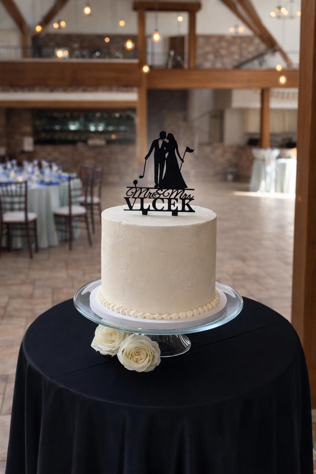 Wedding cake with custom silhouette topper