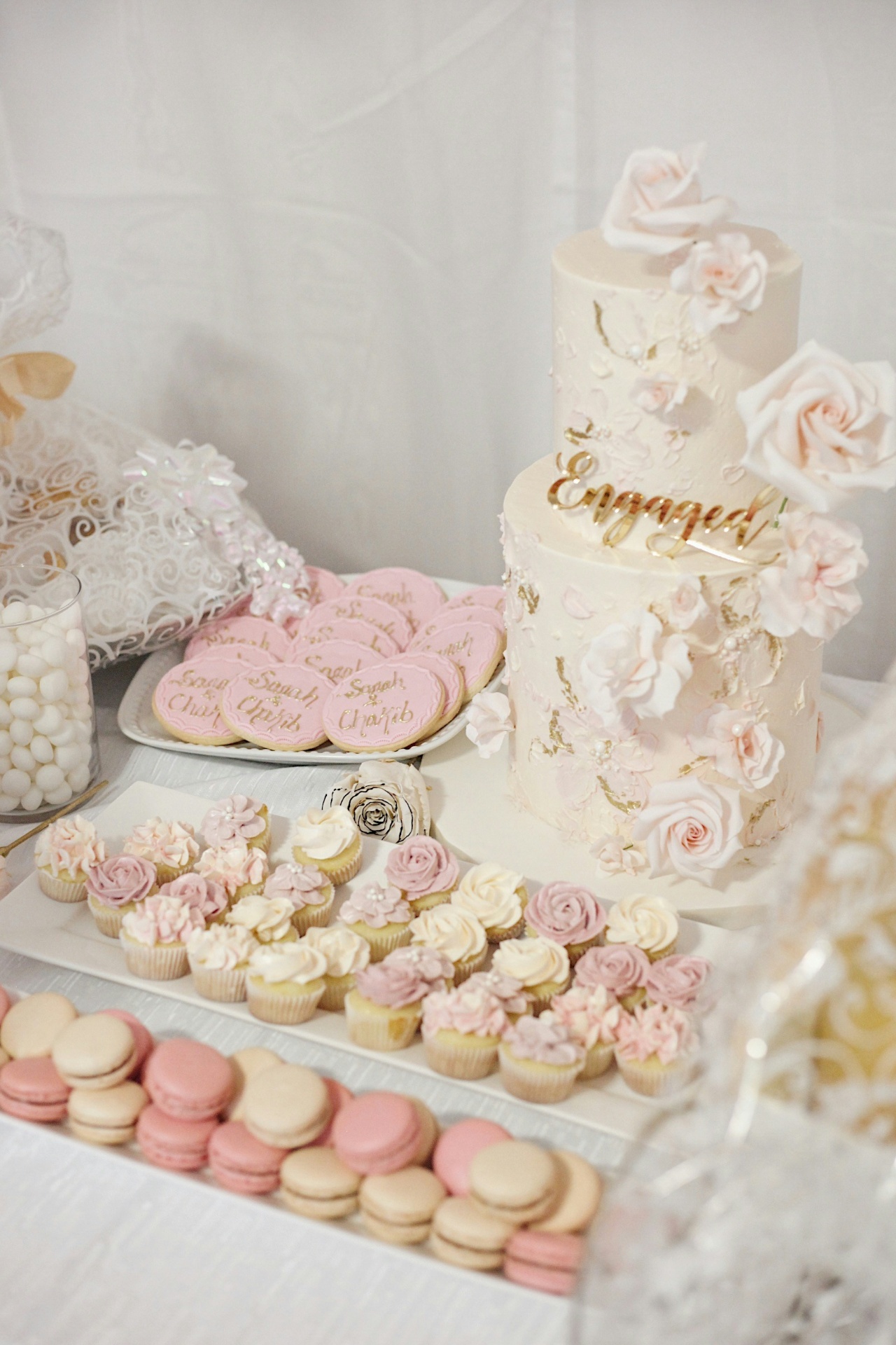 Elegant wedding dessert table with mini cakes and pastries